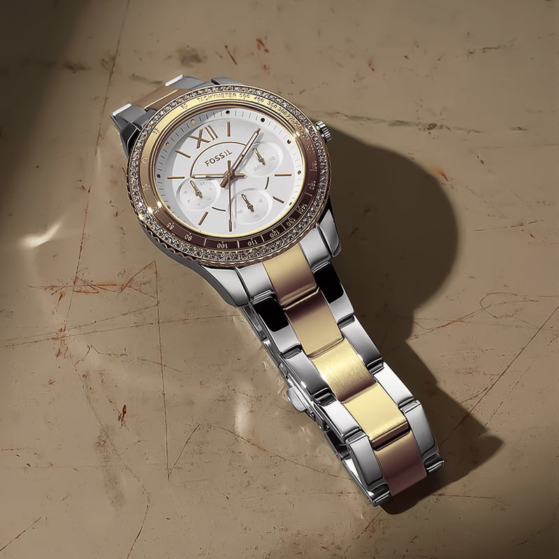 Reloj Fossil ES5107 dorado y plateado, multifuncional de acero inoxidable para mujer, elegante y moderno.