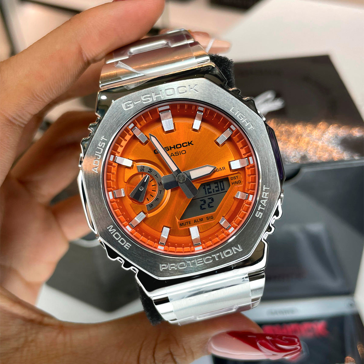 RELOJ G-SHOCK PLATEADO CON NARANJA GM-2110D-4A G-SK-188