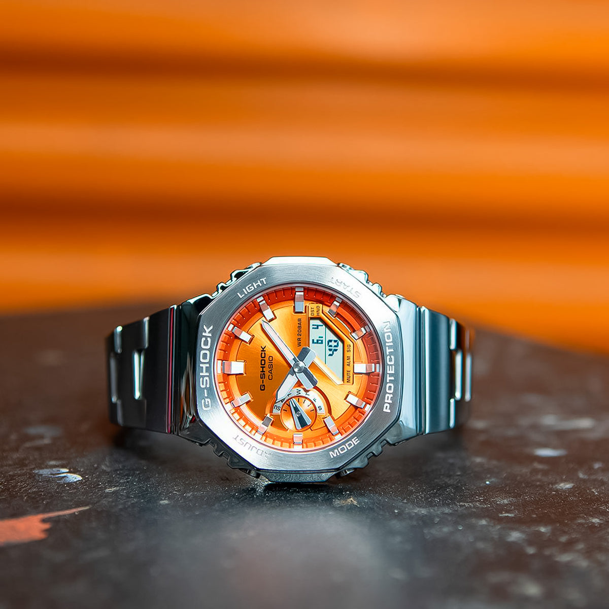 RELOJ G-SHOCK PLATEADO CON NARANJA GM-2110D-4A G-SK-188