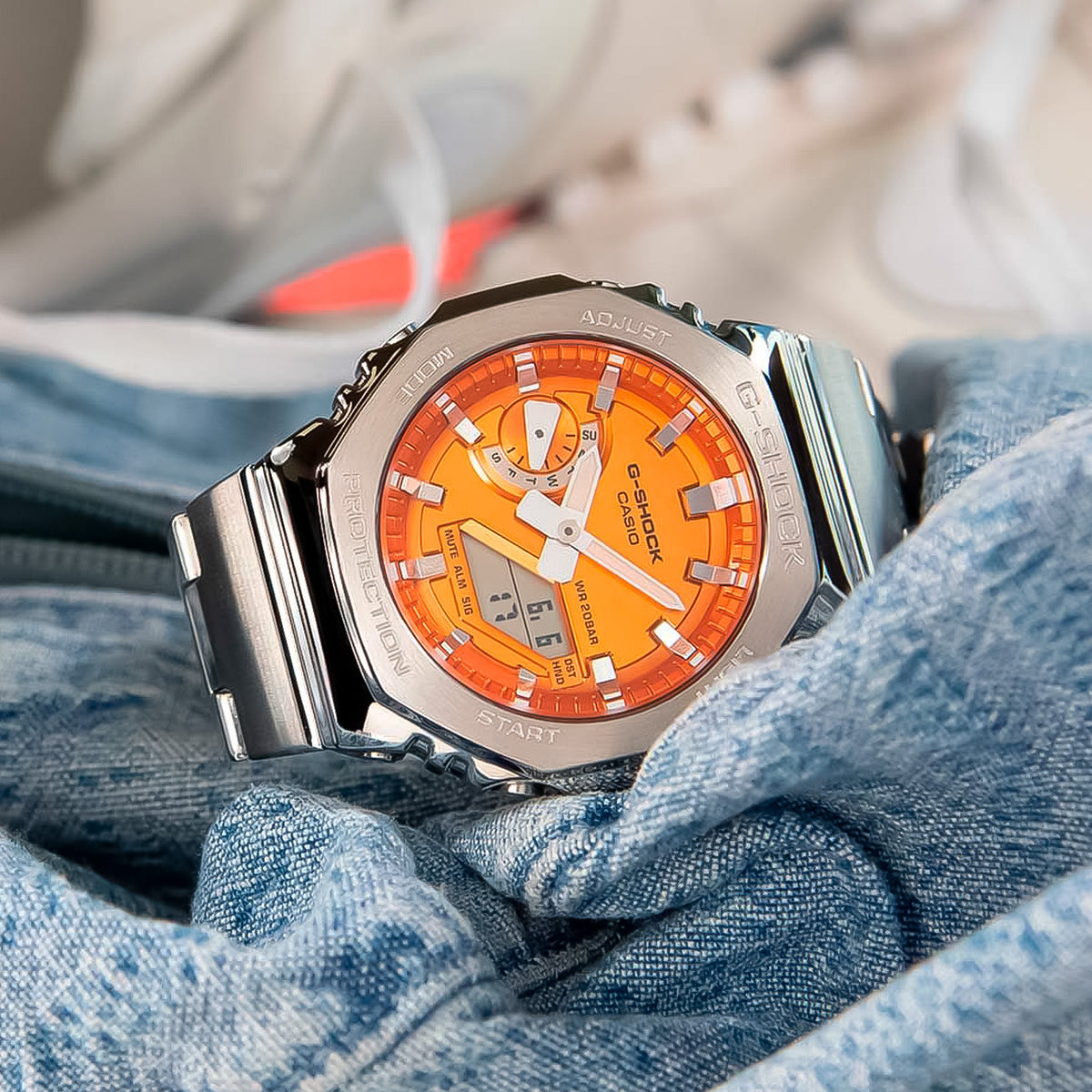 RELOJ G-SHOCK PLATEADO CON NARANJA GM-2110D-4A G-SK-188