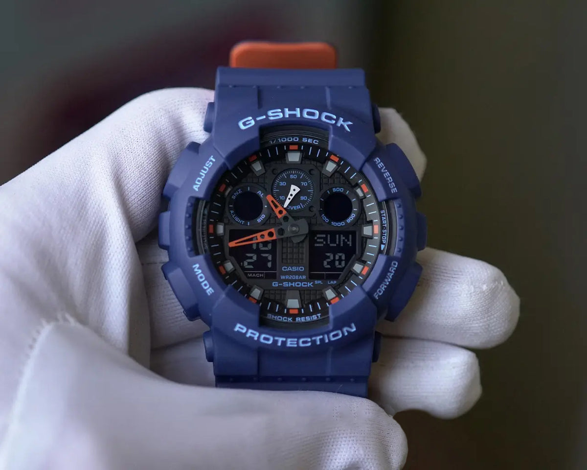 RELOJ G-SHOCK AZUL CON NARANJA GA-100L 2ACR G-SK-68