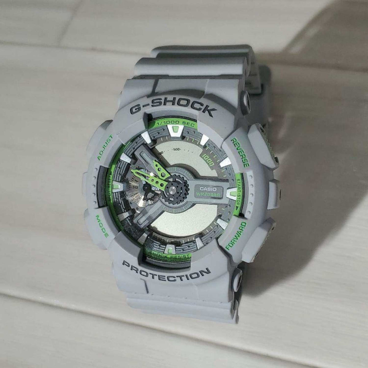 RELOJ G-SHOCK GRIS CON VERDE G-S-219