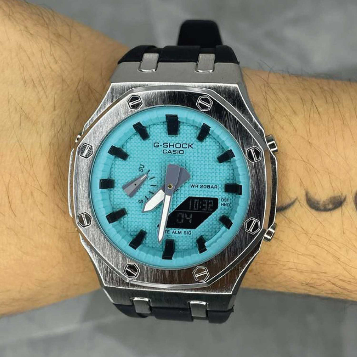 RELOJ G-SHOCK CELESTE CON PLATEADO G-S-225