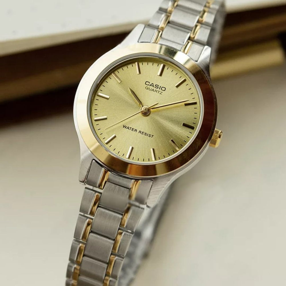 Reloj Casio LTP-1128G-9A bicolor con esfera dorada para mujer