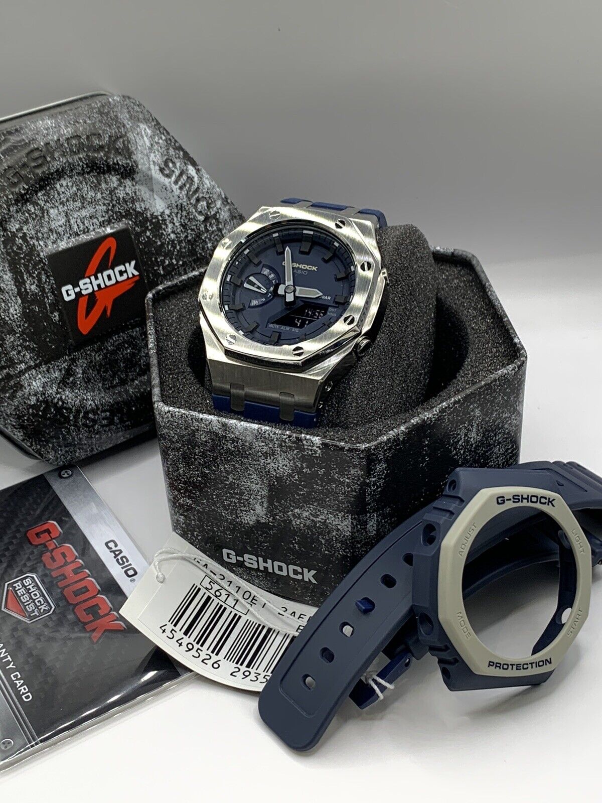 RELOJ G-SHOCK OCTAGONAL PLATEADO CON AZUL G-S-163